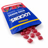 Open Lockins pouch with berry candies spilling out